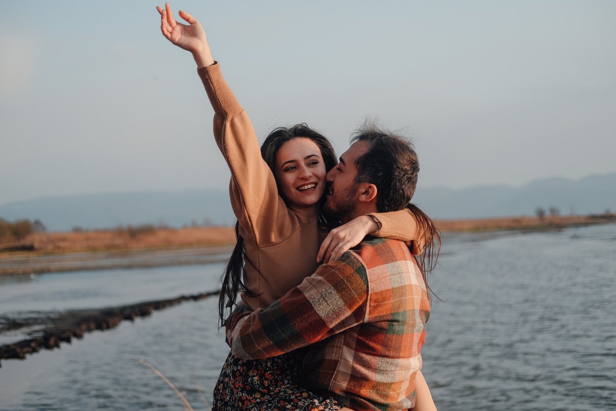 Newly Engaged Couple at Lakeside in Sunset